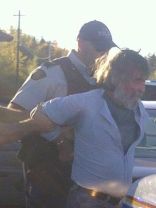 bleeding protestor - was carrying water -- now arrested